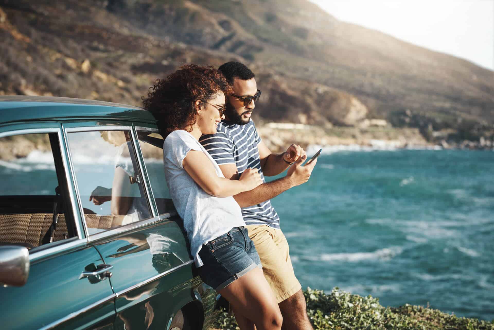 man and woman next to car