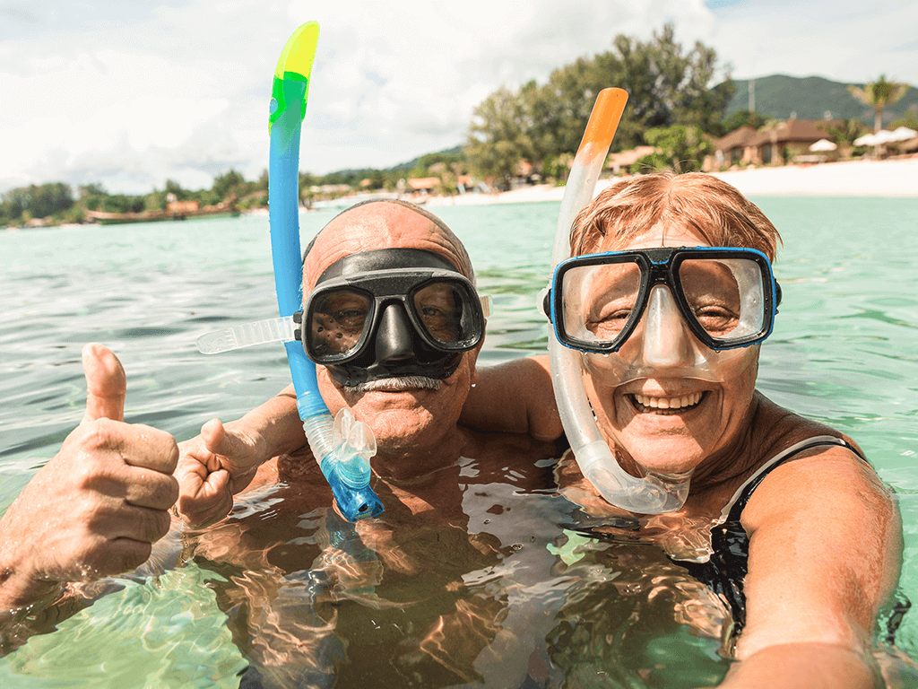 Happy couple snorkelling