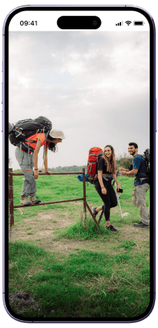 Hiker going over fence