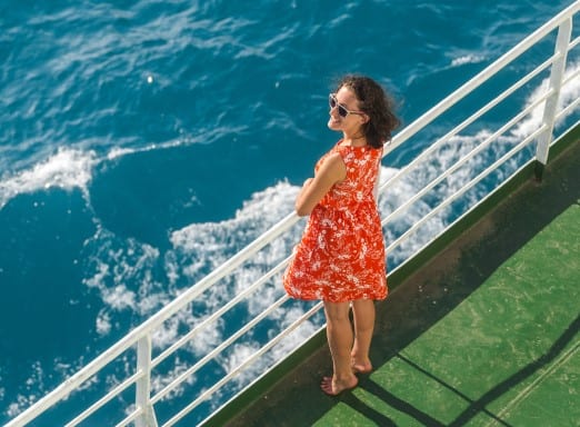 Woman in red dress on cruise ship