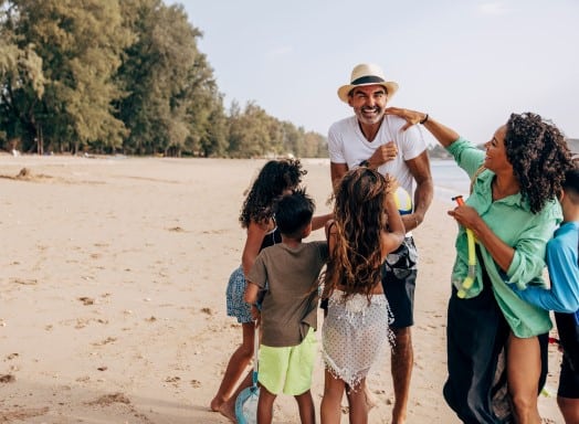 family on beach in thailand