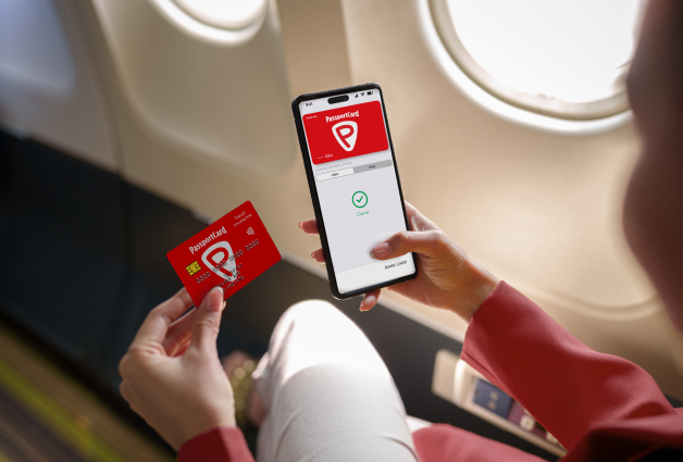 Woman holding phone and card
