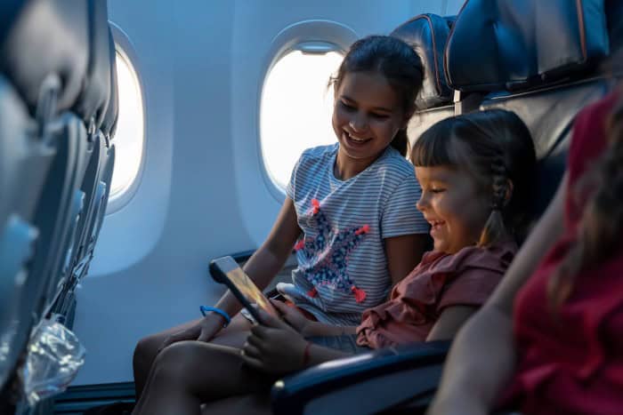 2 little girls on a plane